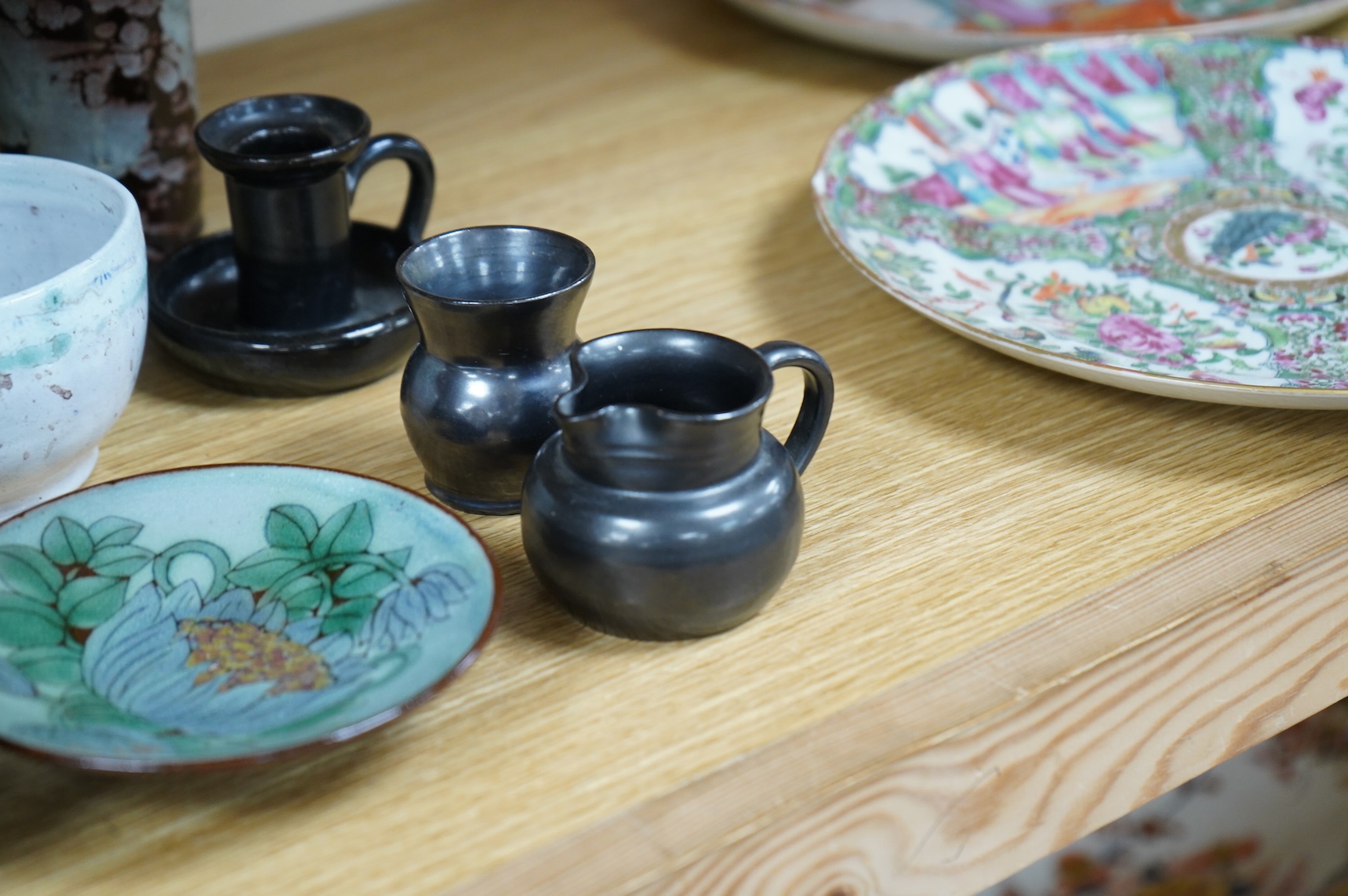 A collection of studio pottery to include a small Danish squat vase, a Brannam, Devon vase and three small Dickerware pieces, largest 13cm high